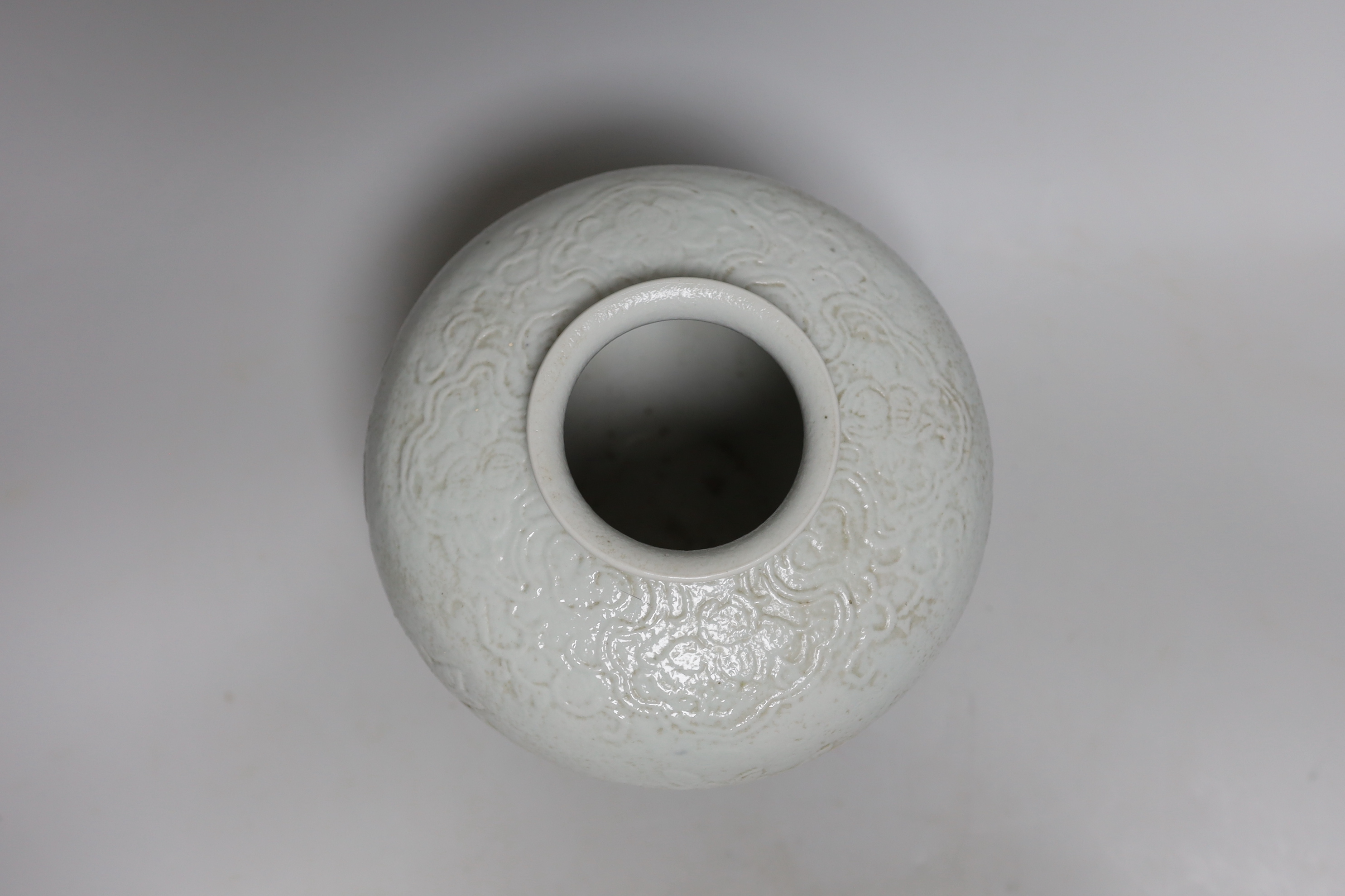 A Chinese moulded white glazed vase, early 20th century, 20cm